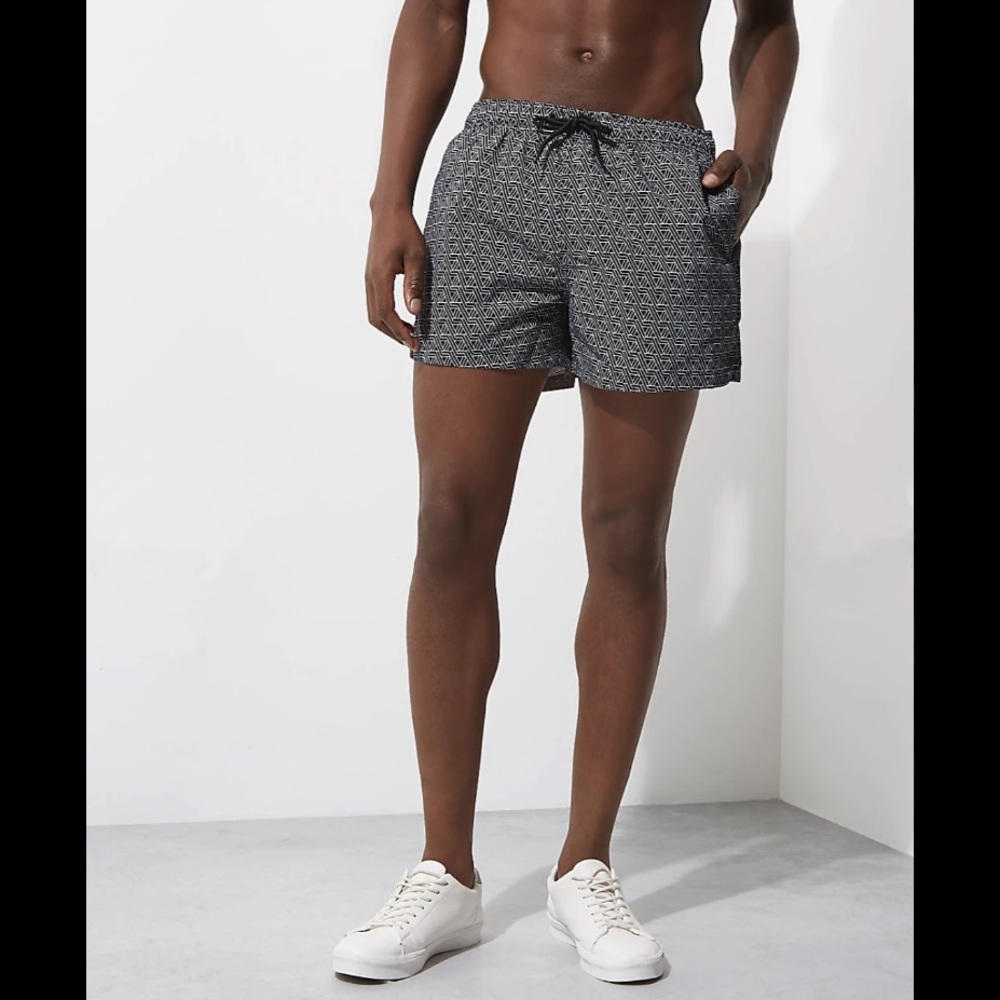 Black and white geometric men’s swimsuit